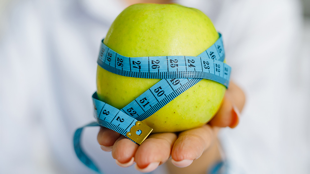 Apple with measuring tape