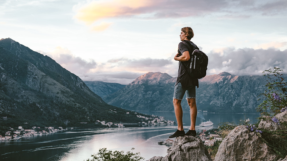 Traveler standing on a mountain